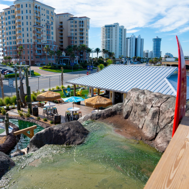 mini golf course with hotels in the background